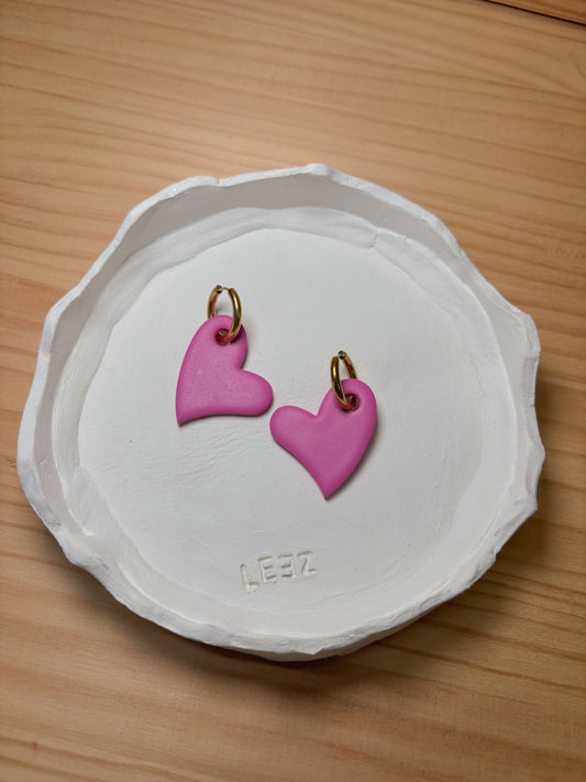 Corazón rosa en aro